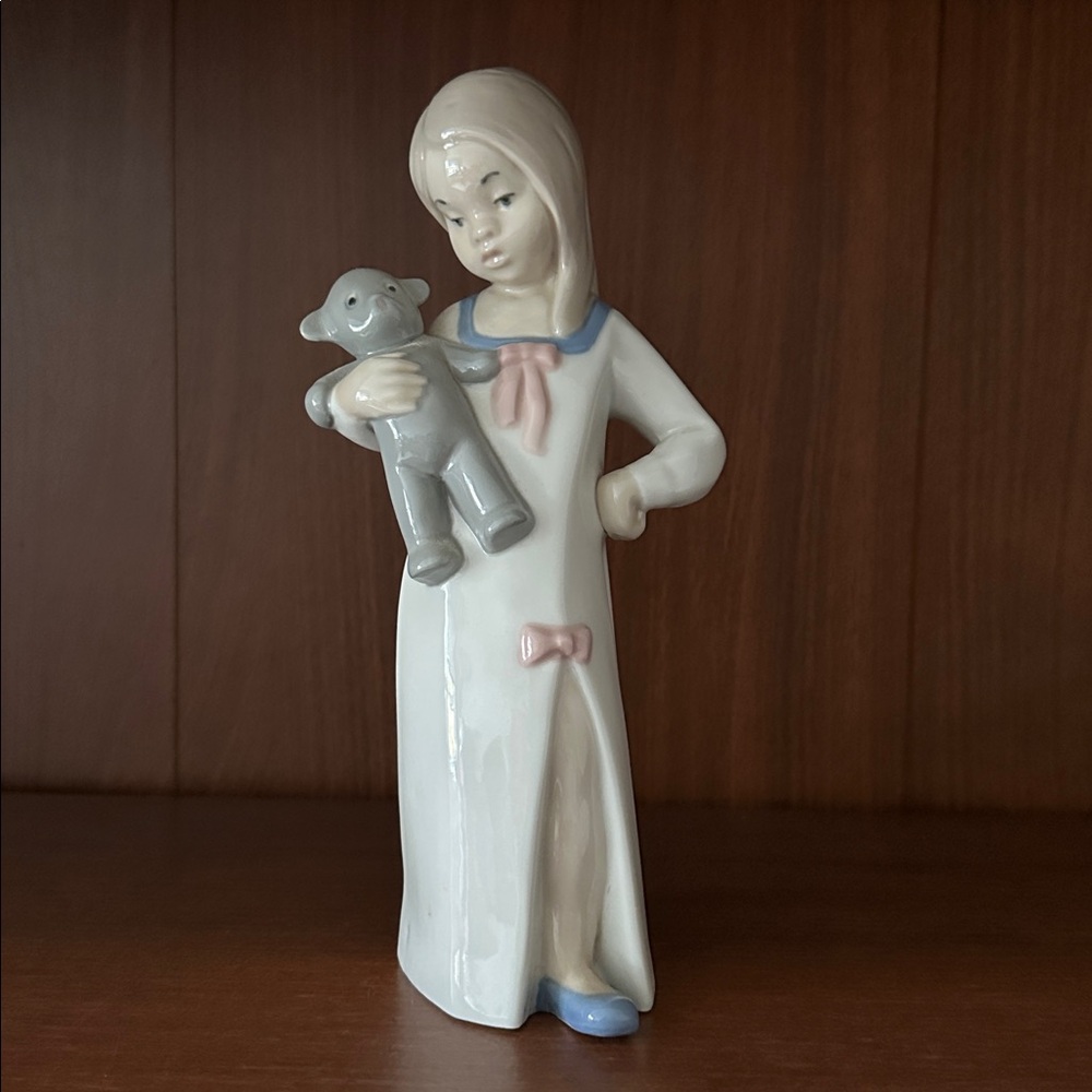 Porcelain Girl Figurine with Toy